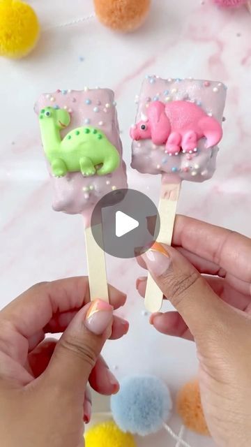 Bakery Bling™ on Instagram: "Pastel Pre-Historic Brownie Pops 🌋🦖☄️✨  Don’t let your cretaceous cake-pop dreams go extinct! @bakedbyprecious cracked the code on how to make the quickest (and dreamiest) dinosaur-themed dessert that even a beginner can master!   Just bake your favorite brownie recipe, let cool, place on a stick, dip in chocolate and cover with your choice of sprinkles + our Dinosaur Glittery Decorating Kit with 100% edible dinosaur icing accessories.   Simple, stylish & sure to be a hit with any dinosaur-lover in your life! Perfect for after school snacks or special lunch box treats! 🩵🦕  #dinosaurbrownies #dinosaurparty #dinosaurbirthday #dinosaurcakepops #cakepops #browniepops #brownies #browniecake #brownie" Dinosaur Treats, Lunch Box Treats, Dinosaur Cake Pops, Brownie Pops, Dino Cake, Lunchbox Treats, Accessories Simple, Themed Desserts, Just Bake