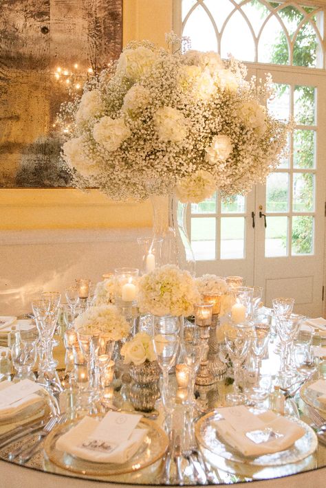 Mirrored Table Tops, Flower Decorations Wedding Table, Moody Lighting Wedding, Mirrored Table Wedding, Top Table Wedding Decor, Mirror Table Top Wedding, Silver And Gold Wedding Decorations, White Silver And Gold Wedding, White And Gold Flower Arrangements