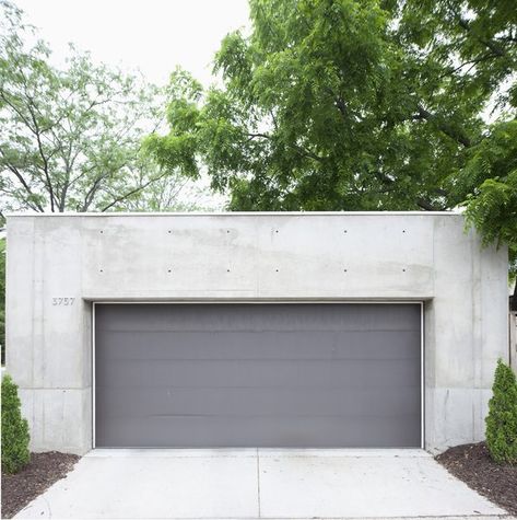 Garage and Detached Garage Room Type The darker gray garage door offers a chromatic and textural contrast to the concrete shell.  My Photos from Modern Urban Retreat in South Minneapolis Dark Grey Garage Door, Gray Garage Door, Gray Garage, Grey Garage Doors, Grey Garage, Concrete Sheds, Detached Garage Designs, Concrete Homes, Sliding Garage Doors