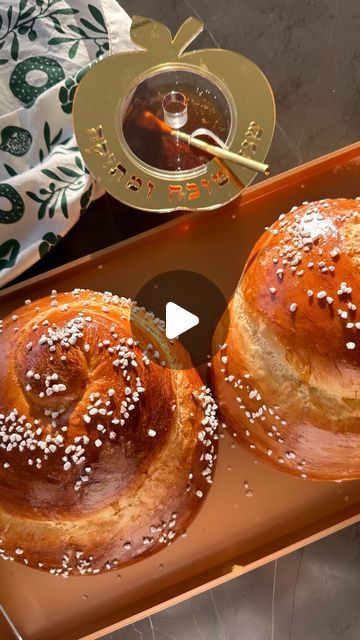 Sivan's Kitchen on Instagram: "ROUND CHALLAH SZN 🍎🍯🍏
Classic and  sweet egg challah recipe for your upcoming high holidays. 

Recipe makes two round challahs. 

Ingredients: 
•4 cups (500 grams) AP flour
•1 tbsp. (10 grams) yeast
•2 large eggs
•1/4 cup (2 oz.) oil
•1.5 tsp. (10 grams) salt
•1/2 cup (105 grams) sugar
Topping: 
Your favorite topping 
Pearl sugar can be found in my amazon storefront in the Rosh Hashana section 
Link is in my bio. 

Instructions:
1. Prepare the Dough:
 * Place all ingredients (except water) into a mixer bowl or large bowl if mixing by hand.
 * Begin kneading the dough. Gradually add the water while kneading.
 * Knead the dough for 12 minutes using a mixer, or about 20 minutes if kneading by hand.
2. Shape the Dough:
 * Coat your hands with a small drop of o Best Challah Recipe, Sivan's Kitchen, Holiday Breads, Round Challah, Sweet Egg, Challah Recipe, Challah Bread Recipes, Jewish Cuisine, Pearl Sugar