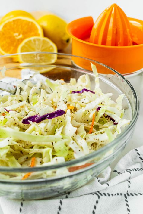 This Sweet Citrus Slaw has been a family favorite for years. It’s a deliciously crisp, tangy and lightly sweet mix of green cabbage, red cabbage, and carrots topped with a mixture of orange juice, lime juice, lemon juice, and maple syrup. #citrusslaw #citruscoleslaw #slaw #slawrecipe #sweetslaw #dinner #sidedish #coleslawrecipe Citrus Coleslaw Recipe, Citrus Slaw Recipes, Citrus Slaw, Cabbage And Carrots, Carrot Slaw, Side Salads, Cabbage Salad Recipes, Citrus Vinaigrette, Meatless Recipes