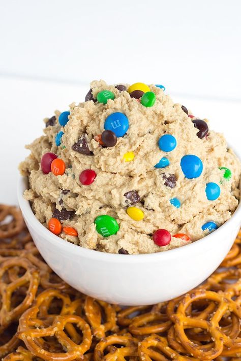 Monster Cookie Dough Dip - dip inspired by the monster cookie and perfect with pretzels. It's loaded with peanut butter, oatmeal, candies, and chocolate chips and whipped until light and airy. Monster Cookie Dough Dip, Protein Dip, Cookie Dough Dip Recipe, Monster Cookie Dough, Cookie Dough Dip, Monster Cookie, Sweet Dips, Dipped Cookies, Edible Cookies