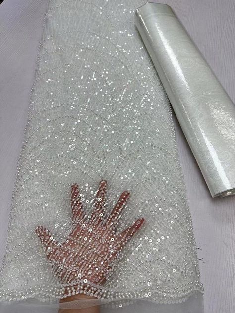 This high quality Fabric is measured in 5 Yards With Embroidered Beading and Sequin. It is soft, very delicate and beautiful. This high Quality Fabric is made with Fashion embroidered rhinestones can be used in making party wedding dresses, skirts, shawls, scarves and other other fashion apparels as you would like. Size : Length : 5 yards (180 inch). Width: 50 inch (Please allow slight deviation for the measurement data ,±1 inch) Material: 100% Polyester, Tulle Lace Fabric, Eco-Friendly embroide Peplum Fabric, Sequence Fabric, Party Wedding Dresses, Hand Beaded Lace, Rhinestone Fabric, Making Fabric, Beaded Lace Fabric, Fashion Sketches Dresses, Embroidered Lace Fabric