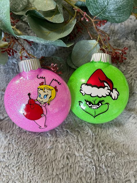 Grinch Ornaments | Christmas Ornament | Holiday Ornaments by MagdaryDesigns on Etsy Grinch Orderments Diy, Diy Christmas Ornaments Grinch, Grinch Christmas Balls Diy Ornaments, Painted Grinch Ornaments, Cindy Lou Who Ornaments Diy, Diy Grinch Ornaments Easy, Max Ornament Grinch, Grinch Ornaments Diy How To Make, The Grinch Christmas Decorations Diy