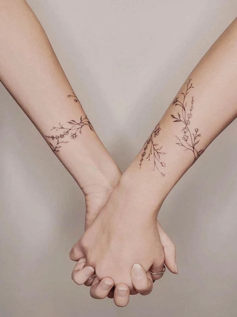 Floral Tattoo Around Arm, Similar Tattoos For Sisters, Sister Floral Tattoo, Matching Fine Line Tattoos For Sisters, Minimalist Dogwood Tattoo, Bridesmaid Tattoo Ideas, Matching Vine Tattoos, Boho Sister Tattoos, Matching Line Art Tattoos