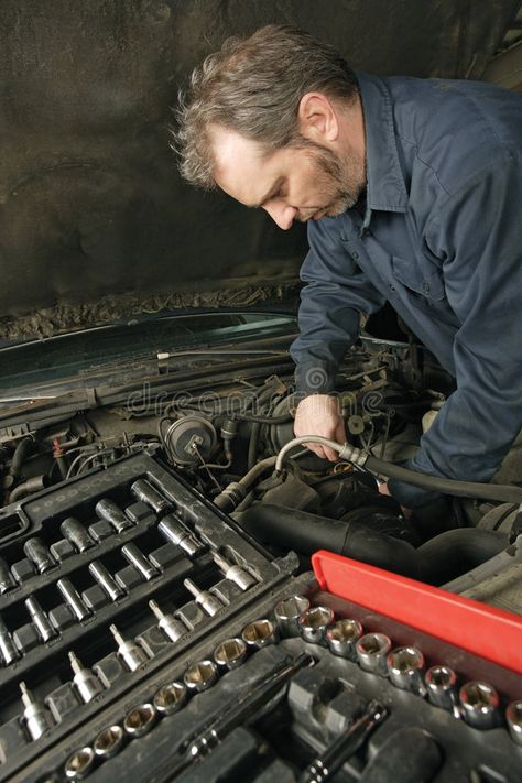 Mechanic repairing an engine. A mechanic repairing an engine of an old car #Sponsored , #sponsored, #sponsored, #repairing, #mechanic, #engine, #Mechanic Mechanics Aesthetic, Mechanic Tools, Technology Logo, Old Cars, Stock Images Free, Digital Design, Technology, Stock Images, Repair