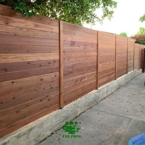 Define your outdoor space with our custom fencing solutions, designed to offer superior strength and beauty.  Contact us today - https://www.theprosincorporated.com -- #fencedesign #fencebuilding #fencingservices #fencingboston #fenceinstallation #fenceservices #outdoorbackyard #outdoorfencing #outdoorfence #outdoorfenceligh Fences Design, Staining Wood Fence, Wood Fence Ideas, Redwood Fence, Fence Stain, Outdoor Fencing, Modern Fence Design, Privacy Fence Designs, Horizontal Fence