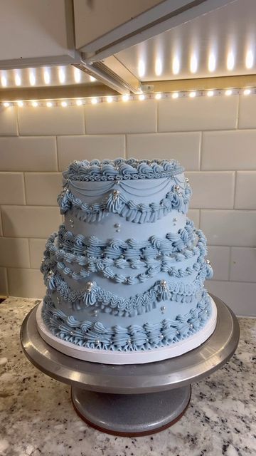 Tay on Instagram: "Glittery blue ✨ #buttercream #buttercreamcakes #buttercreamcake #cake #cakedecorating #cakedesign #wilton #wiltontips #wiltoncakes #austintx #austintexas #austin #texascakes#cakesofinstagram #austincakes#buttercreamdecorating #heartcake #pearlcake #birthdaycake #vintagecake #shellborder #rufflecake #ruffleborder #ediblepearls #y2kcake #shellborder #buttercreamdesign" Sweet Sixteen Cakes Blue, Sweet 16 Cinderella Theme Cake, Sweet 16 Winter Wonderland Theme Cake, Periwinkle Birthday Cake, Blue Victorian Cake, Sweet 16 Cakes Blue And Silver, Blue And White Sweet 16 Cake, Light Blue Cake Ideas, Sweet 16 Cake Ideas Blue