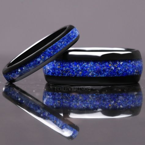 ►Material: Tungsten Carbide and Crushed Lapis Lazuli ►Color: Black ►Comfort Fit ►His Band Width: 8mm ►Her Band Width: 4mm ►Fit is true to size for Her band (4mm). ►Fit is slightly loose for His band (8mm), but should order as true to size. If you are between half sizes, recommend going down to the next closest half size for His band (8mm). ►This hand-crafted tungsten ring features an inlay of crushed Lapis Lazuli. Its deep, celestial blue will stand out amongst the crowd of standard wedding band Royal Blue Wedding Ring, Inlay Rings, Black Ring Set, Royal Blue Wedding Theme, White Wedding Ring, Gem Drawing, Couples Ring, Celestial Blue, Royal Blue Wedding