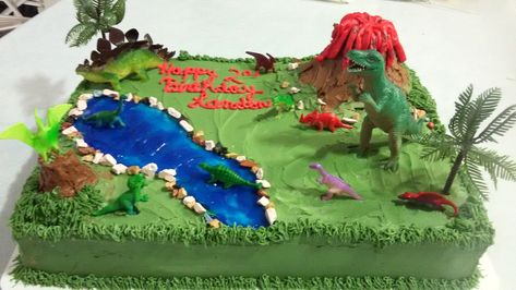 Dinosaurs 1/2 sheet cake - 1/2 chocolate w/banana cream filling. 1/2 orange cake with pineapple filling. The Good Dinosaur Cake, Jurassic Birthday, Dino Birthday Cake, Volcano Cake, Savory Cakes, Dino Cake, Birthday Sheet Cakes, Dinosaur Birthday Cakes, Cake Simple