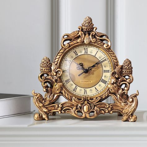 This vintage desk clock features silent operation and high-quality resin. Hand-made with exquisite carvings and bronze gold, it is low-key and luxurious, suitable for offices, study rooms, living rooms, etc.Note: This product requires one AA battery, which is not included. Jordan Baker, Carved Table, Gold Clock, Retro Clock, Antique Clock, Tabletop Clocks, Study Rooms, Clock Decor, Desk Clock