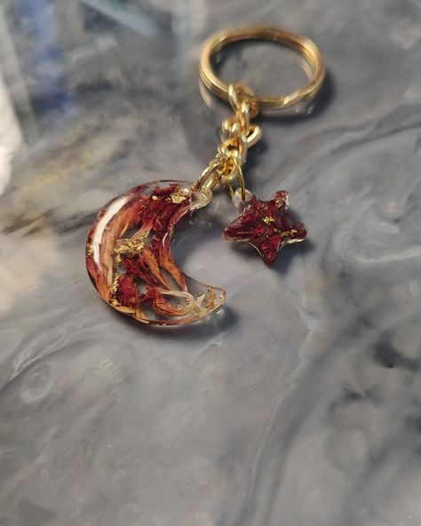 💫✨ A piece of the night sky you can carry with you! Our moon and star keychain with preserved flowers is a celestial beauty. #resinpendant #resinkeychain #flowerpreservation #resincustomkeychain Star Keychain, Resin Artist, Artist Workshop, Preserved Flowers, Moon And Star, The Night Sky, Custom Keychain, Resin Pendant, How To Preserve Flowers