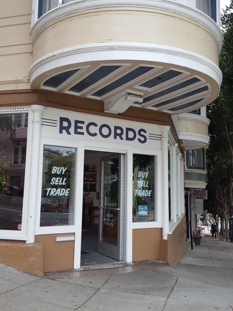 San Francisco buy, sell, trade vinyl record store with white exterior and hand painted signage. Record Store Exterior, Painted Signage, Front Door Awning, Vinyl Record Store, Record Stores, Record Cleaner, Old Records, Door Awnings, White Exterior