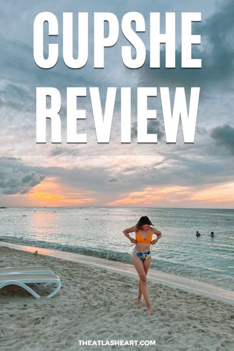 A woman in a yellow bikini top and blue leaf-printed bottoms adjusts her top and looks down at her feet while walking on a tropical beach during a slightly overcast sunset, with the text overlay, "Cupshe Review." Cupshe Swimwear, Cupshe Dress, Cupshe Bikinis, Cupshe Swimsuits, Amazon Travel, Travel Necessities, Affordable Swimwear, Travel Must Haves, Best Swimwear