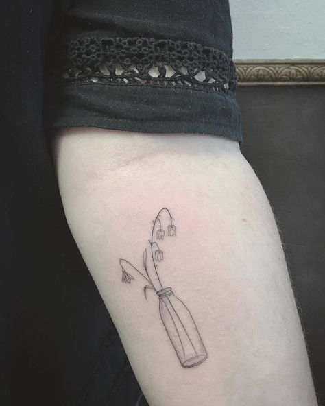 Single needle wild flowers in a bottle tattoo on the left inner forearm. In A Bottle Tattoo, Flowers In A Bottle, Wine Tattoo, Whimsical Tattoos, Bottle Tattoo, Floral Tattoo Design, Poke Tattoo, Line Work Tattoo, Line Art Tattoos