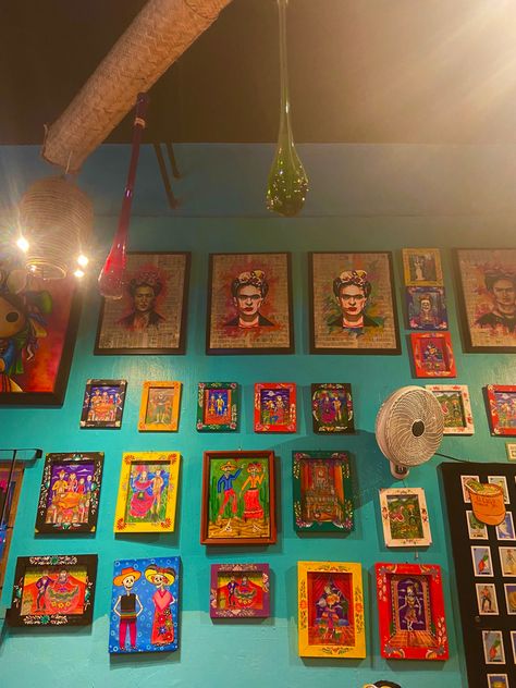 A wall with paintings of Frida Kahlo and skeletons. Colorful paintings Frida Kahlo House Mexico City, Frida Kahlo Aesthetic, Wall With Paintings, Frida Kahlo Decor, Khaki Aesthetic, Frida Kahlo House, Exhibition Ideas, Coffee Shop Interior Design, Frida Kahlo Art