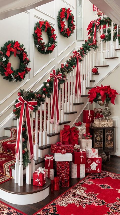 Looking for modern Christmas inspiration? Check out these red and white Christmas decor ideas for a sleek and stylish holiday. Red Outdoor Christmas Decor, Christmas Deco Stairs, Christmas Spiral Staircase, Christmas Railing Ideas, Christmas School Decor Ideas, Christmas Decoration Stairs, Christmas Decor Ideas For Stairs, Stair Christmas Decor Ideas, Stair Railing Ideas Christmas Decor