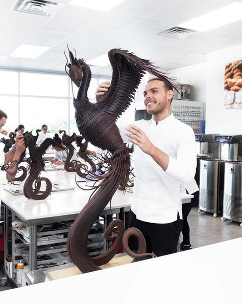 Amaury Guichon on Instagram: "Chocolate Phoenix! 🔥 Swipe left to take a closer look! This one is really dear to my heart, as it is a redo of a showpiece done 3 years ago. It took 5 days and 2000 chocolate feathers to complete. #amauryguichon #chocolate #phoenix 📸: @fionaguichon" Chocolate Feathers, Amaury Guichon, Chocolate Sculpture, Chocolate Showpiece, Moving To Las Vegas, Leaving Las Vegas, Chocolate Sculptures, Chocolate Work, French Pastry