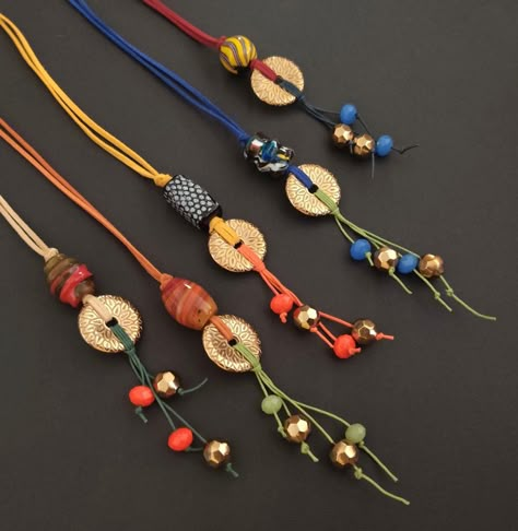 "Long colorful beaded boho/hippie style necklace. CHOOSE YOUR COLOR from the drop down menu, Please Refer to Image 2 for pattern choices and their numbers. This necklace is the perfect day boho accessory to add to your collection. Its great teamed with a casual summer outfit or even just a plain tee and jeans. You have 5 bright attractive colors to choose from! The focal unit of this rather fun and Trendy bohemian necklace is made up of a gorgeous large handmade glass trade bead, a metalized acr Indian Handmade Jewelry, Bohemian Handmade Jewelry, Afro Jewelry, Collar Hippie, Long Boho Necklace, Boho Hippie Style, Long Necklace Boho, Colorful Bohemian, Attractive Colors