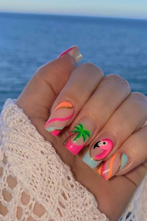 Embrace the tropical vibes with these almond-shaped summer vacation nails. A playful pink base is accented with a charming flamingo design, bringing a splash of vibrant personality. Swirling stripes of hot pink, pastel blue, and shining gold elegantly wrap across other nails, enhanced by a soothing palm tree motif that whispers the promise of relaxing beach days. The combination of pastels and lively hues make for a perfect summertime accessory. Beachy and chic! 🌴🦩  // Photo Credit: Instagram @nailsbykatyrose Tropical Holiday Nails Summer, Simple Nail Designs Ideas, Nail Art Designs Palm Trees, Tropical Nails French Tips, Lilly Pulitzer Nails Designs, Tropical Disney Nails, Love Island Nails, Margaritaville Nails, Hot Summer Nails 2024