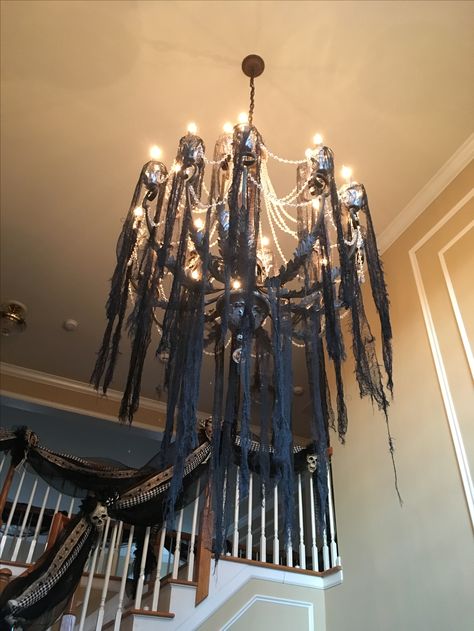 Halloween creepy cloth chandelier Halloween Decor Chandelier, How To Decorate Chandelier For Halloween, Halloween Venue Decorations, Chandelier Halloween Decor, Halloween Chandelier Diy, Diy Halloween Chandelier, Halloween Chandelier Decor, Cloth Chandelier, Halloween Gala