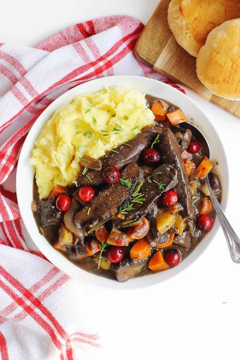 This is my go to recipe for cranberry vegan portobello pot roast! A warm and hearty vegetarian mushroom and veggie pot roast with cranberries. Perfect for a holiday main dish, a meatless Christmas, or a cozy dinner. // Rhubarbarians // Portobello Pot Roast, Vegetarian Thanksgiving Main Dish, Vegan Portobello, Thanksgiving Vegetarian, Thanksgiving Main Dishes, Vegetarian Thanksgiving Menu, Thanksgiving Main Dish, Vegetarian Stuffing, Vegetarian Gravy