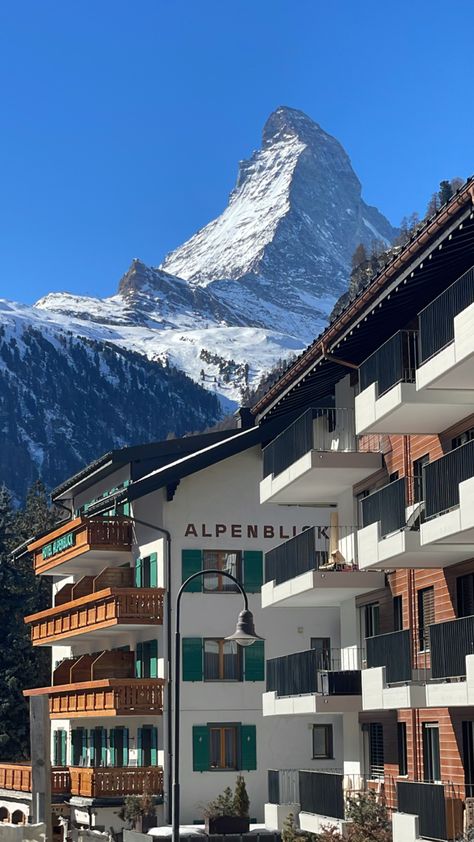 A view of the Matterhorn from Zermatt, Switzerland Zermatt Switzerland Spring, The Matterhorn Switzerland, Switzerland Aesthetic Vintage, Zermatt Aesthetic, Zermatt Switzerland Summer, Switzerland Town, Swiss Apartment, Swiss Chalet Interior, Switzerland Skiing