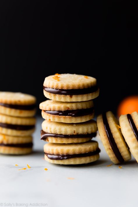 Butter shortbread cookies with orange zest and chocolate ganache! These deliciously soft cookie sandwiches taste just like Milano cookies! Recipe on sallysbakingaddiction.com Butter Shortbread Cookies, Milano Cookies, Iced Oatmeal Cookies, Cookie Cookbook, Cookies With Chocolate, Orange Chocolate, Chocolate Sandwich, Chocolate Sandwich Cookies, Buttery Cookies