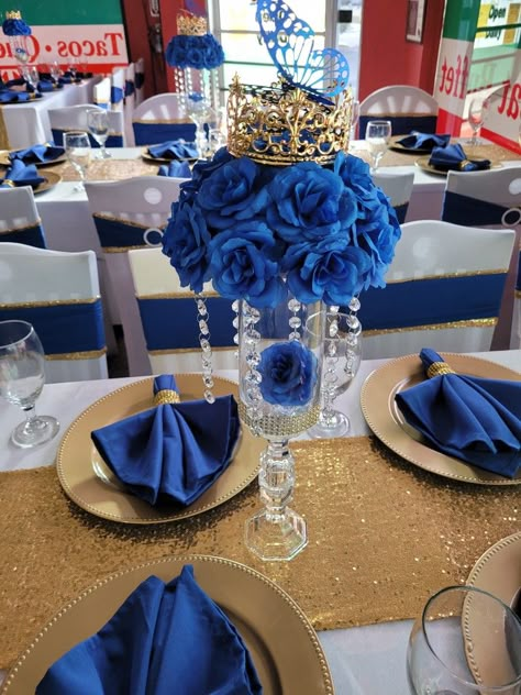 Dark Blue And Silver Centerpieces, Blue And Gold Themed Party, Royal Blue Centerpiece Ideas, Royal Theme Centerpieces, Dark Blue Centerpieces Quince, Royal Blue And Silver Quinceanera Centerpieces, Navy Blue Quinceanera Centerpieces, Navy Blue Quinceanera Ideas Table, Royal Blue And Gold Centerpieces Quince