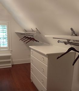 Slanted Ceiling Art Studio, Slanted Wall Closet Ideas, Shelves On Slanted Wall Sloped Ceiling, Angle Closet Ideas, Slanted Roof Closet Ideas, Attic Bedroom Ideas Angled Ceilings Slanted Walls Closet Space, Loft Closet Ideas Slanted Walls, Slanted Walls Closet, Attic Walk In Closet Slanted Ceiling