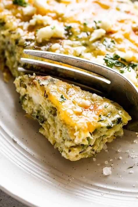 Savory, healthy Zucchini Egg Bake is the perfect easy breakfast, light lunch, brunch specialty, or vegetarian dinner! A satisfying blend of fresh veggies, whole eggs, feta cheese, and fragrant herbs. Zucchini Souffle Recipe, Healthy Vegetarian Casserole, Egg Casserole Recipes Healthy, Egg And Veggie Casserole, Zucchini Egg Bake, Healthy Egg Casserole, Souffle Recipes Easy, Eggs Feta, Veggie Egg Bake