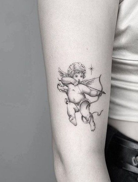 28 Best Tattoo Ideas For Women in 2020 - The Trend Spotter Cherub Tattoo Designs, Angel Tattoo For Women, Cupid Tattoo, Tato Dada, Cherub Tattoo, The Trend Spotter, Chest Tattoos For Women, Wrist Tattoos For Women, Tattoo Ideas For Women