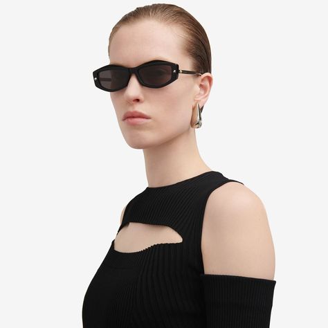 Black acetate sunglasses fitted with solid smoke lenses. The sunglasses have a geometrical shape and are detailed with silver spike studs on both the front and the metal temples. Finished with a lasered Alexander McQueen signature. Iconic Fashion, Acetate Sunglasses, Leather Denim, Scarf Jewelry, Black Metallic, Pendant Earrings, Denim Top, Ring Gift, Sneaker Boots