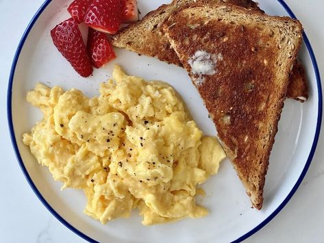 Julia Child Taught Me the Secret to the Fluffiest Scrambled Eggs and My Mornings Will Never Be the Same — Kitchn Scrambled Eggs And Toast, Best Trader Joes Wine, Simple Scrambled Eggs, Eggs And Toast, Pierogi Recipe, Buttered Toast, Julia Child Recipes, Fluffy Scrambled Eggs, Scrambled Eggs Recipe