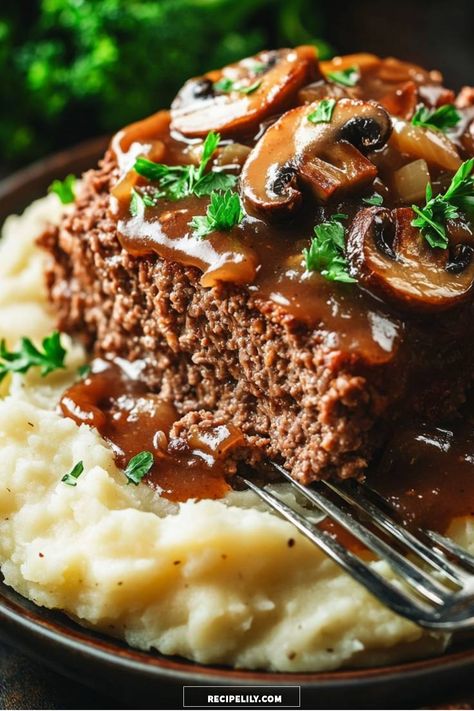 I love how this savory meatloaf, topped with a rich mushroom gravy, pairs perfectly with creamy mashed potatoes. This comfort food classic is not only easy to make but also brings back memories of family dinners gathered around the table. You won’t want to miss this delicious recipe! Mushroom Gravy Meatloaf, Meatloaf Recipes With Brown Gravy, Meatloaf With Mushroom Gravy, Meatloaf With Brown Gravy, Mushroom Meatloaf Recipes, Brown Gravy Meatloaf, Mushroom Skillet, Mushroom Meatloaf, Savory Meatloaf