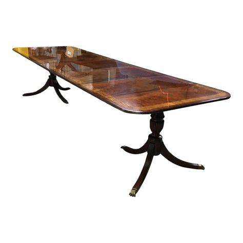 This is a made-to-order large traditional mahogany banquet/dining table made in the Leighton Hall shop in Suwanee, Georgia. It features a field of slip-matched swirly crotch mahogany from west Africa and Satinwood and Pau Ferro borders from South America.  It has a hand rubbed and polished semigloss finish. The pedestal has three fluted legs which terminate with antique brass lions paw feet. Dimensions: 42 in. x 70 in. With three 22 in. Leaves (total length with leaves inserted is 136 in..) Victorian Dining Table, Regency Dining Room, Sunroom Dining, Lions Paw, Suwanee Georgia, Banquet Dining, Mahogany Dining Table, Transitional Dining Room, Mahogany Furniture