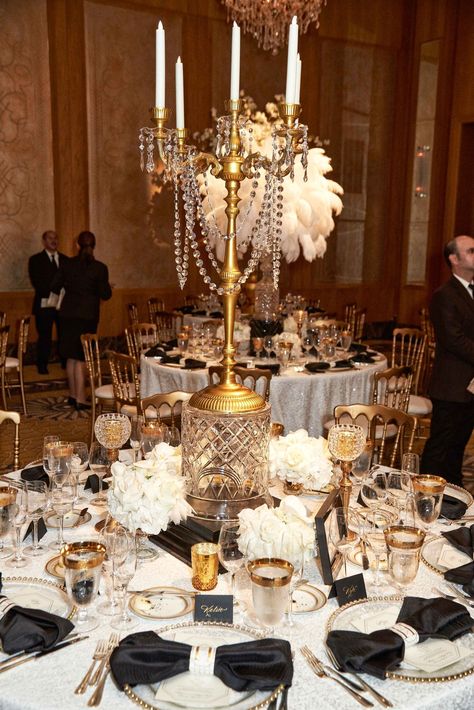 wedding-reception-vintage-deco-inspired-crystals-gold-candelabra-centerpiece-tall-arrangement Wedding Elegant Centerpieces, Gatsby Birthday Party, Roaring 20s Wedding, Gatsby Party Decorations, Hollywood Glam Wedding, 20s Wedding, Gatsby Wedding Theme, Candelabra Centerpiece, Old Hollywood Wedding