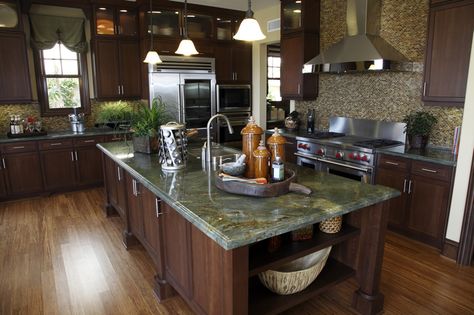 Custom kitchen with green granite countertops, island, dark brown cabinets and mosaic tile backsplash Green Granite Kitchen, Green Granite Countertops, Golden Lightning, Green Countertops, Green Granite, Kitchen Countertop Materials, Granite Countertops Kitchen, Best Kitchen Designs, Dark Kitchen Cabinets