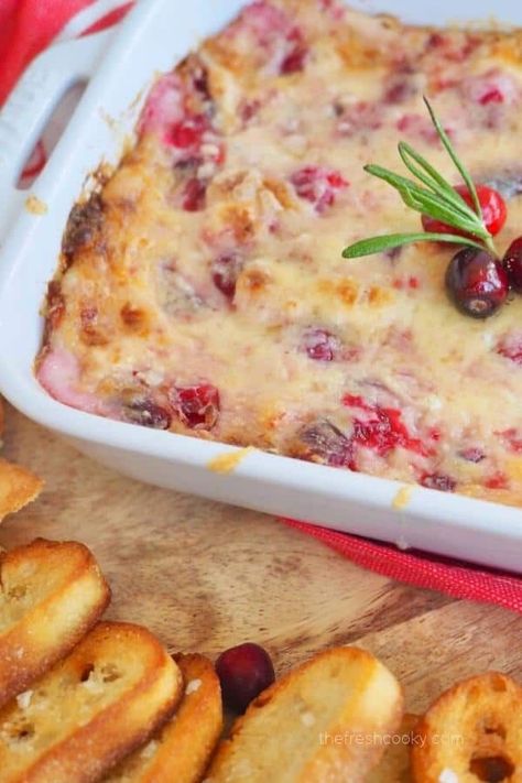 This Cranberry Cream Cheese dip is not only easy, it’s delicious and perfect for the holiday season. 4 simple ingredients to this cheesy, sweet-tart, salty and savory dip. Using homemade cranberry sauce (or leftover) and fresh cranberries this cream cheese cranberry dip will be a hit at your next party. #ChristmasDipRecipes #Recipes #Christmas Taste Of Home Cranberry And Bacon Swiss Cheese Dip, Baked Cranberry Cream Cheese Dip, Baked Orange Cranberry Cream Cheese Dip, Spicy Cranberry Cream Cheese Dip, Cranberry Cheese Dip, The Best Christmas Appetizer Cranberry Jalapeno Dip, Baked Mashed Potato Bites, Cranberry Cream Cheese Jalepeno Dip, Christmas Dips