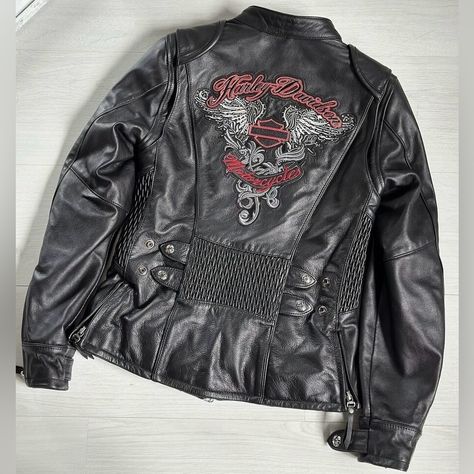 Women’s Harley Davidson Amelia Leather Jacket With Rhinestones Size 2xl Brand Harley Davidson Amelia Colors Black Leather, Red And White Size 2 Xl Measurements 45 1/2” 47 1/2” Bust 31 1/4” 32 1/2” Sleeve Length It Is Made Of Lightweight Goatskin Leather With Poly-Twill Lining. It Features Mandarin Collar, 2-Way Zipper Front, Highly Detailed Zipper Pull, Action Back, Body Armor Pockets At Elbows And Shoulders, Zipper Cuffs, Pre-Curved Sleeves, Power Stretch Side Panels With Snap Tab Double Adjusters On Each Side, Lightly Padded Shoulders, 2 Zippered Hand Warmer Pockets, 2 Inside Pockets (1 Zippered And 1 Not), Metal Badge On The Bottom Left Hem. Harley Davidson Jacket, Body Armor, Side Panels, Leather Jackets, Mandarin Collar, Hand Warmers, Front Zipper, Coats For Women, Harley Davidson