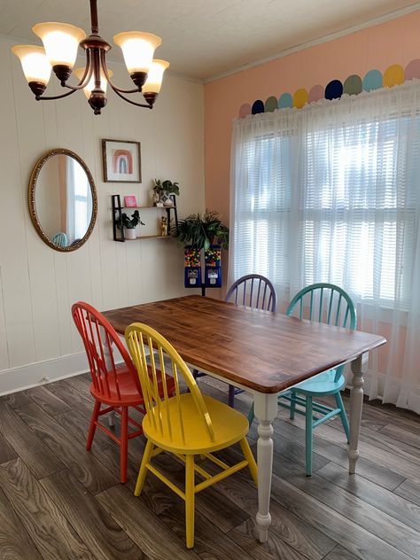 Colorful Kitchen Table And Chairs, Rainbow Dining Chairs, Funky Painted Dining Table, Colorful Cottage Dining Room, Dining Room Design Colorful, Colorful Table And Chairs, Table With Colored Chairs, Colored Dining Table, Colorful Kitchen Table