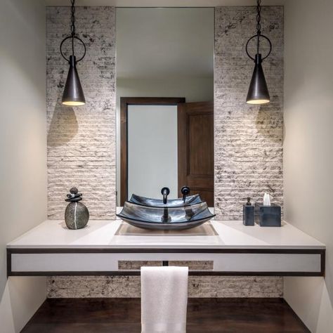 This powder room elevates its look with a whitewashed brick accent wall, dramatic vessel sink and bold pendants. Check it out only at HGTV.com. Brick Powder Room, Neutral Powder Room, Room With Brick Wall, Whitewashed Brick, Bold Bathroom, Brick Accent Wall, White Wash Brick, Power Room, Modern Mountain