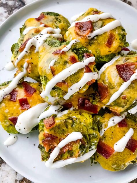 Loaded Smashed Brussels Sprouts are topped with the popular potato toppings of cheese, bacon, sour cream, and chives. A healthy twist, this side dish recipe is gluten free and keto low carb. Roasted, not boiled, and fast to make. Loaded Brussel Sprouts, Roast Beef Pinwheels, Beef Pinwheels, Brussels Sprout Recipes, Smashed Brussels Sprouts, Roast Beef And Horseradish, Baked Brussel Sprouts, Sprouts Recipes, Yummy Vegetable Recipes