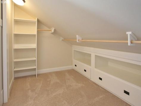 B's closet - close off storage w/ wall, large sliding doors(??) to access storage space; pole; shelves @ both ends Slanted Ceiling Closet, Attic Wardrobe, Slanted Walls, Attic Closet, Slanted Ceiling, Attic Design, Attic Bathroom, Attic Bedrooms, Closet Remodel