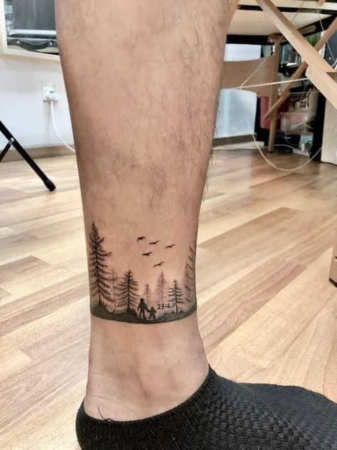 Forest Ankle Tattoo, Mountain Ankle Tattoo Wrap Around, Minimalist Forest Tattoo, Forest Band Tattoo Design, Band Tattoo Ankle, Nature Arm Band Tattoo, Ankle Tattoo Men Ideas, Ankle Band Tattoo Mens, Nature Band Tattoo