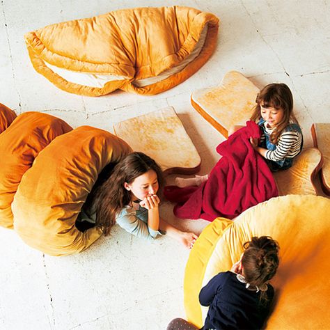 Brian Ashcraft of Kotaku recently discovered that Japanese online store Felissimo is selling super cute bread beds, a collection of soft cushions, pillows, and sleeping bags that look like deliciou… Japanese Pastries, Japanese Bread, Japanese Store, Geek Decor, Sleeping Bag, Bean Bag Chair, Duvet, Pastry, Kids Room