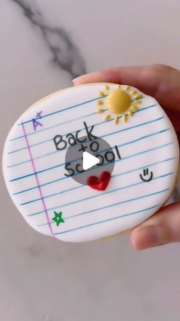 The Cookie Box Club on Instagram: "Yep, countdown is on! 

Notebook cookies are so cute and they can be personalized in so many different ways! Here’s how to make your own notebook cookies: 

✨ Flood your cookie with white icing and let the icing completely dry. Yes, dry. We always wait at least 18-24 hrs. Just ice them the day or night before you plan to make your lines. Ice them all so they’ll be ready to become notebooks the day after. 
✨ Using a blue edible marker, draw horizontal lines using a ruler or something that has a flat edge. Here we used a scraper. Wait at least 15-20  minutes for the edible marker to dry a bit. Trust us on this. 
✨ Using a pink or red edible marker, draw a vertical line. 
✨ Write your message and add any other details you want. Here we added a heart and sun Notebook Cookies, Make Your Own Notebook, Icing Design, White Icing, Horizontal Lines, Cookies Decorated, Cookie Box, Cookie Ideas, The Day After