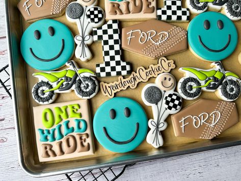 Ford’s first year was One Wild Ride 🏍️🏁 • How fun and cute of a theme is this!? This riding theme was a first for me and I couldn’t wait to get started! I was so excited when this sweet mama, @brie_matthews, reached out for Ford’s 1st birthday with these ideas! Bringing them to cookie life was a blast and it was a cherry on top seeing his party tie everything together! Also, can we talk about these colors? I love them together!! • • • #onewildride #firstbirthday #birthdayboy #customcookies #b... One Wild Ride First Birthday, Wild One Birthday Cookies, First Birthday Cookies, Boys First Birthday Party, Boys First Birthday Party Ideas, Boys First Birthday, Can We Talk, First Birthday Party Ideas, Boy First Birthday