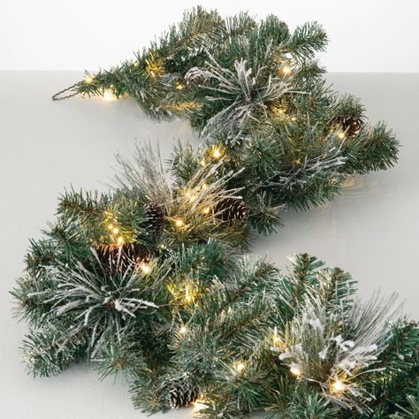 PRICES MAY VARY. Elegant Flocked Pine Garland With Gold Accents: Enhance your Christmas decor with our 9' Artificial Flocked Pine Garland. This stunning Christmas garland features lifelike, snow-frosted pine needles, natural pinecones, gold glittered accents, and lights creating a festive and wintry look perfect for any holiday setting. Prelit with Warm White LED Twinkle Lights: Illuminate your indoor Christmas decorations with this lighted garland. Prelit with warm, white LED lights, it casts a Framing Doorway, Pinecone Garland, Artificial Christmas Garland, Warm White Led Lights, Christmas Decorations Garland, Pine Garland, Artificial Garland, Artificial Flowers And Plants, Pillows Flowers