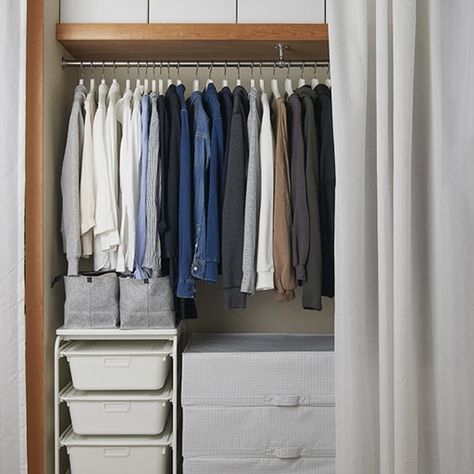 An open wardrobe in an alcove with clothes rail, shelf and boxes, and T-shirts hanging on a rail across a window. Alcove Clothes Storage, Cupboard Clothes, Bedroom Alcove, Clothes Storage Systems, Alcove Wardrobe, Rail Shelf, Alcove Storage, Coat Hanger Stand, Canvas Wardrobe